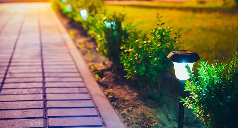 Lighting fixtures along a path