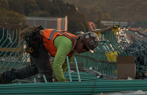 Man working on electrical conduit